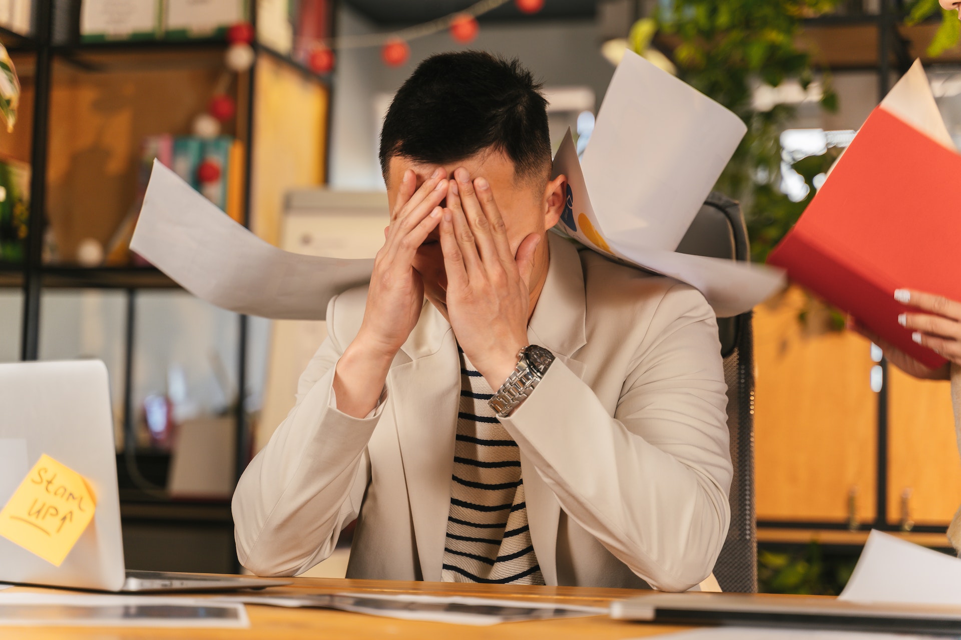 What is work-related stress and what are some of its signs?